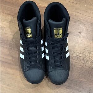 Adidas pro model Black and White High-Tops with Gold Accents